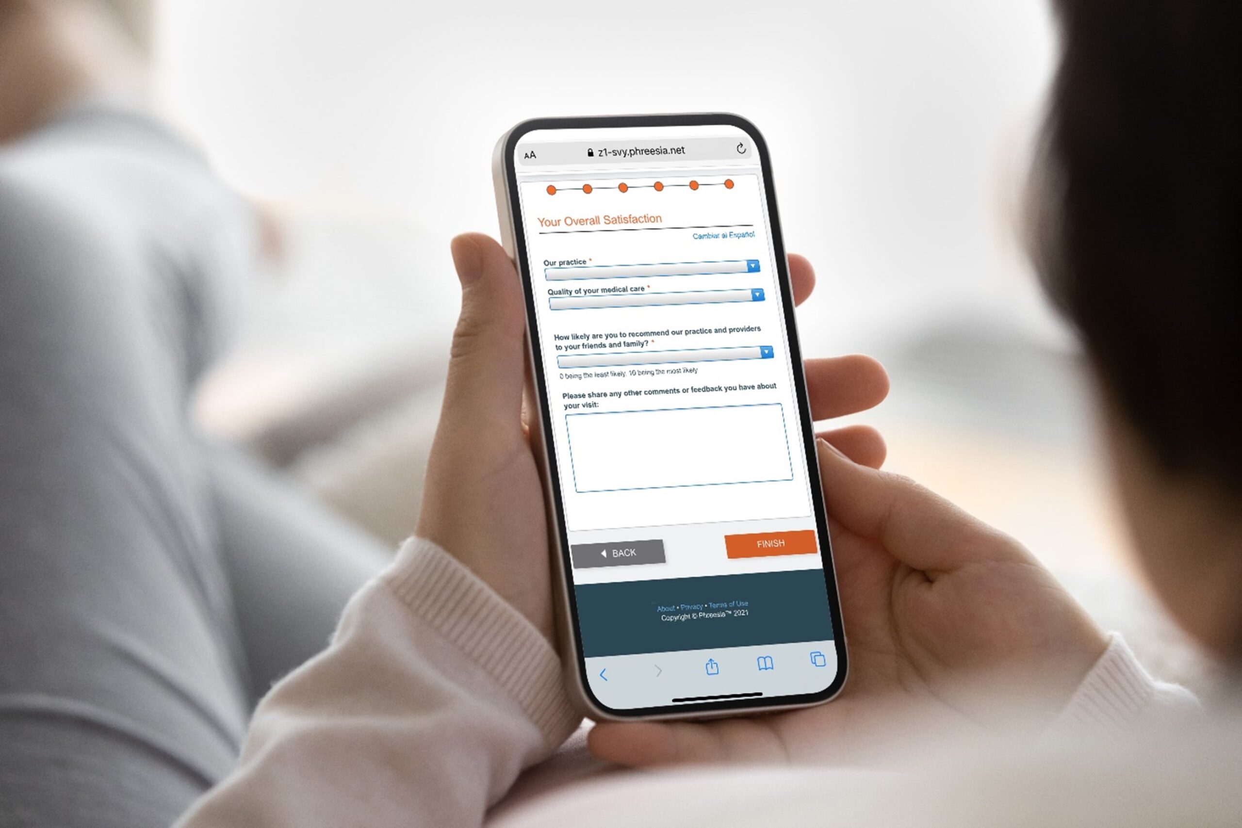 11-surveys a patient looking at a post-visit satisfaction survey on a mobile phone